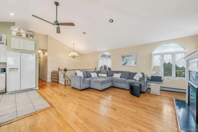 a large kitchen with cabinets and wooden floor