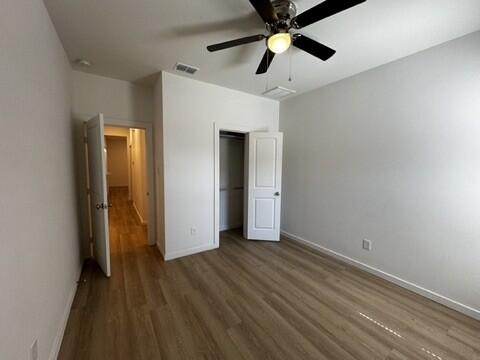 5511 Itasca Street Lubbock, TX 79416 - Photo 13 of 21 wooden floor in an empty room with a window