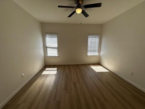 5511 Itasca Street Lubbock, TX 79416 - Photo 15 of 21 a view of empty room with wooden floor and window