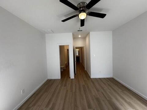 5511 Itasca Street Lubbock, TX 79416 - Photo 16 of 21 wooden floor in an empty room with a window