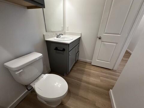 5511 Itasca Street Lubbock, TX 79416 - Photo 17 of 21 a bathroom with a toilet sink and mirror