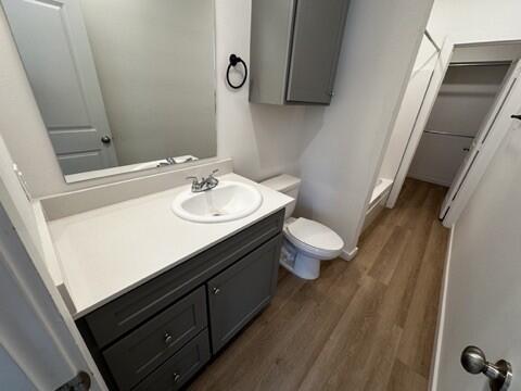 5511 Itasca Street Lubbock, TX 79416 - Photo 18 of 21 a bathroom with a sink a toilet and mirror