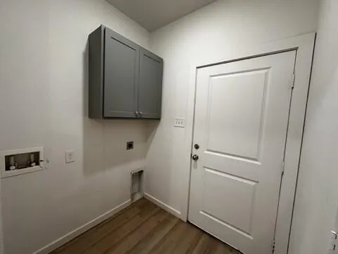 a room with a wooden floor and closet