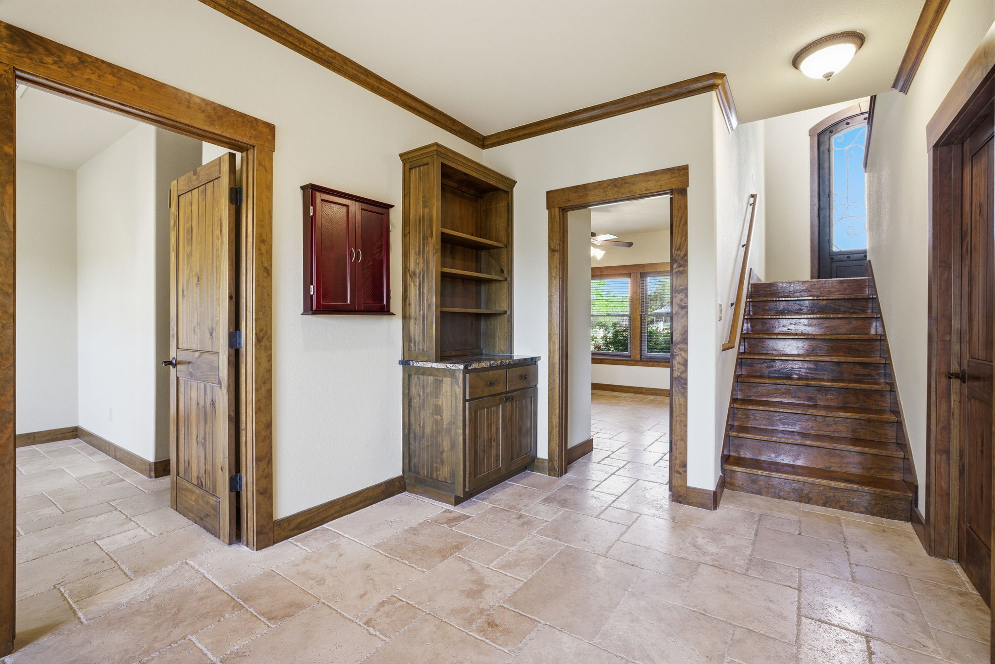 5010 Lookout Ridge Drive Marble Falls, TX 78654 - Photo 1 of 40 Stairway featuring crown molding, stone tile flooring, and a ceiling fan