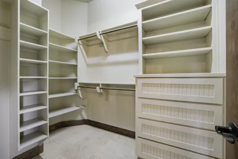 a spacious bathroom with a double vanity sink double and a mirror