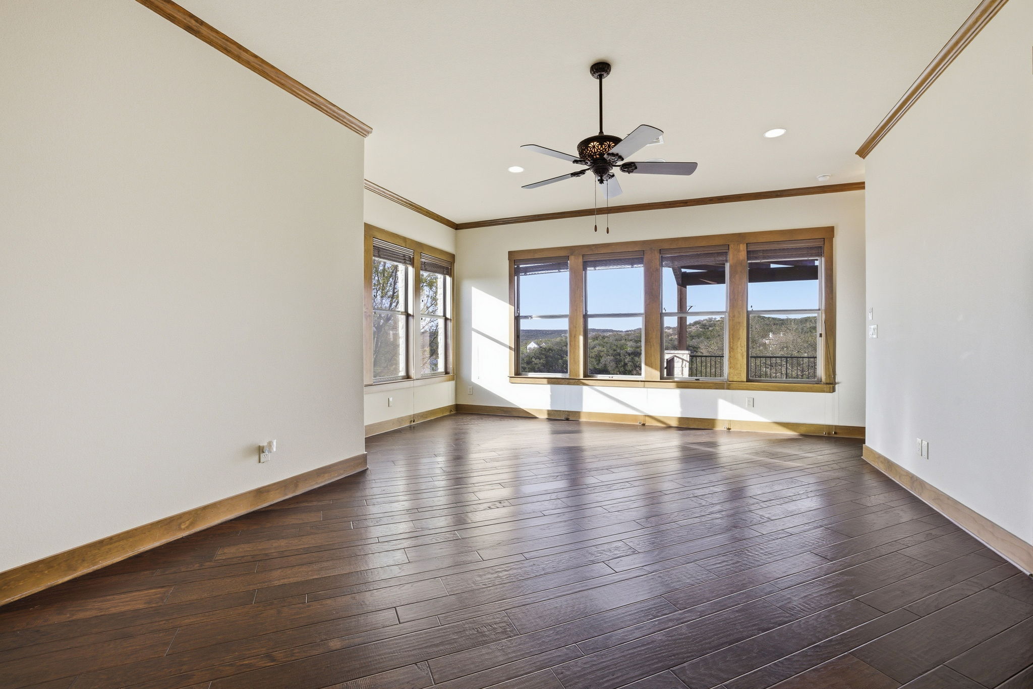 5010 Lookout Ridge Drive Marble Falls, TX 78654 - Photo 24 of 40 Spare room with dark wood-style flooring, crown molding, a ceiling fan, and recessed lighting