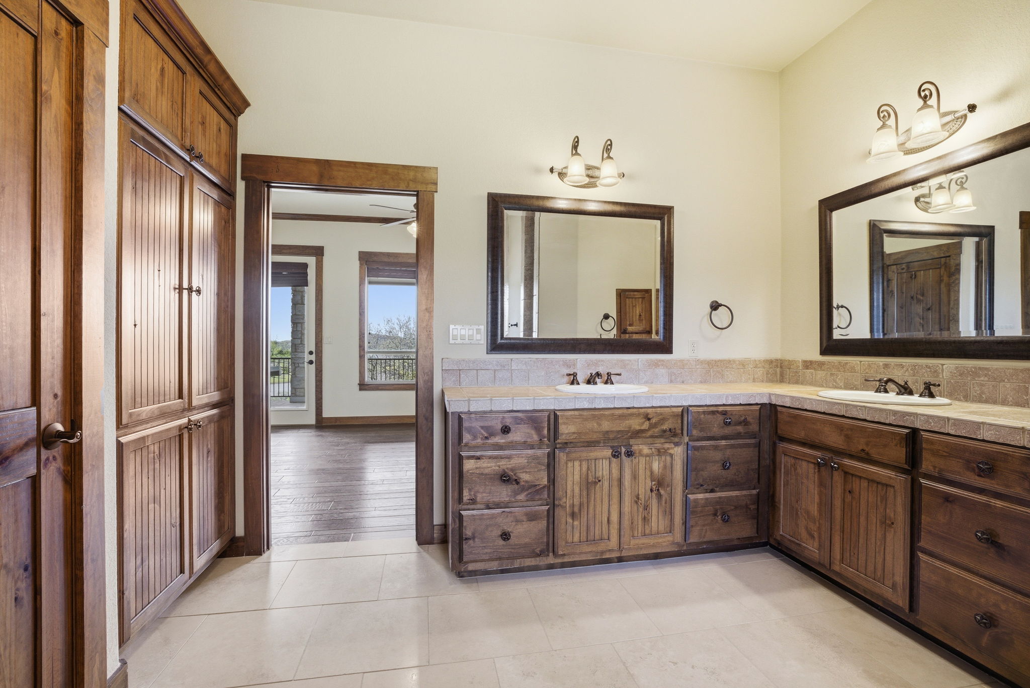 5010 Lookout Ridge Drive Marble Falls, TX 78654 - Photo 32 of 40 Full bathroom featuring double vanity and light tile patterned floors