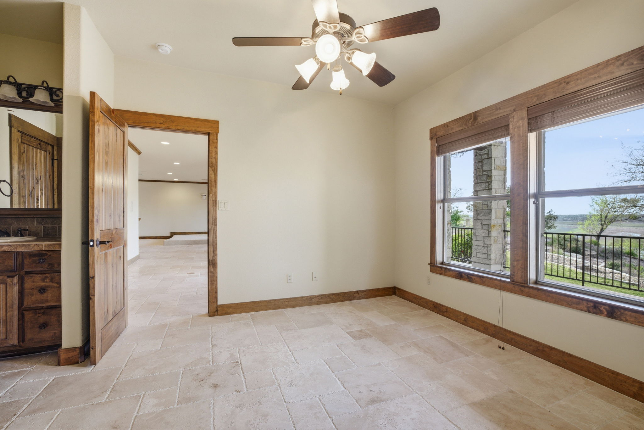 5010 Lookout Ridge Drive Marble Falls, TX 78654 - Photo 4 of 40 Unfurnished room with stone tile flooring and a ceiling fan