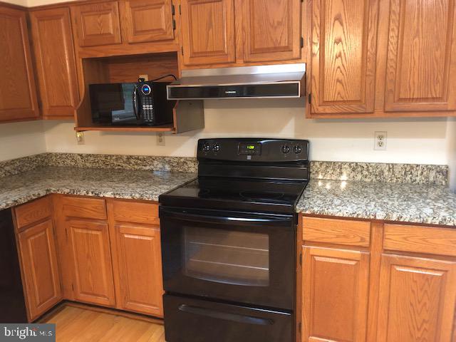 12946 Soundings Road Lusby, MD 20657 - Photo 2 of 55 Granite counters and lots of cabinets