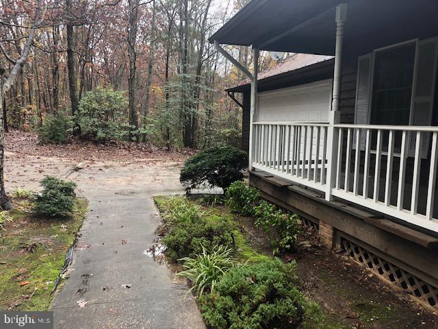 12946 Soundings Road Lusby, MD 20657 - Photo 42 of 55 Front sidewalk and oversized driveway