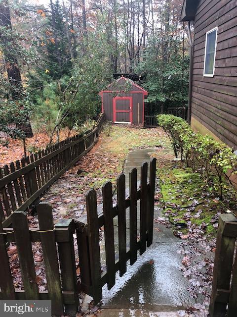 12946 Soundings Road Lusby, MD 20657 - Photo 43 of 55 Side yard and shed