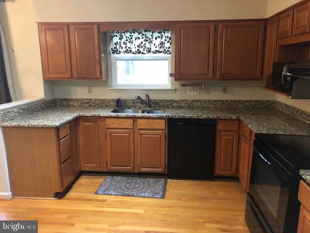12946 Soundings Road Lusby, MD 20657 - Photo 6 of 55 Granite counters and wood floors