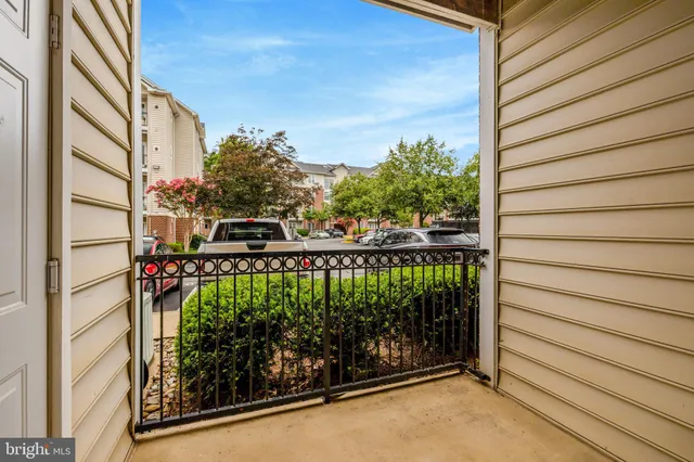 a view of a balcony with plants