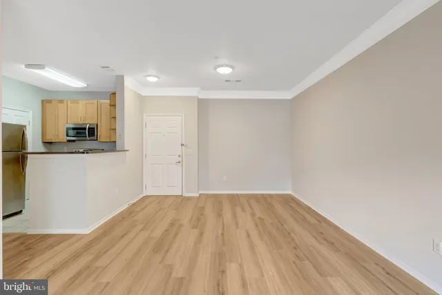 a view of a kitchen with wooden floor