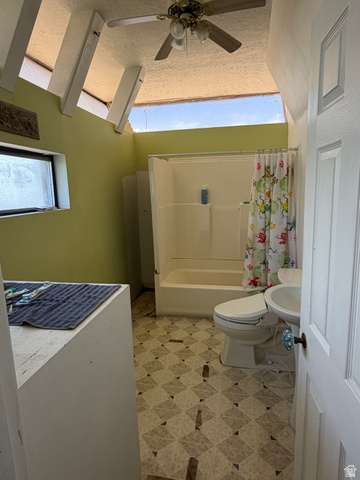 255 E Centre Spring City, UT 84662 - Photo 20 of 34 Bathroom featuring a fiberglass tub/shower combination, pedestal sink, and patterned sheet vinyl flooring