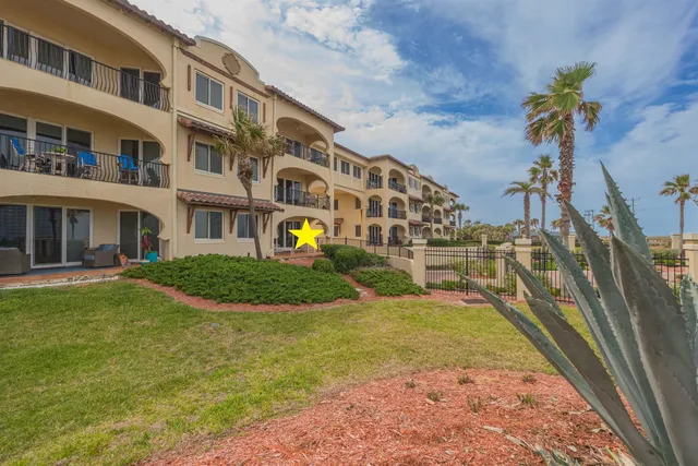 a view of a field with an ocean view