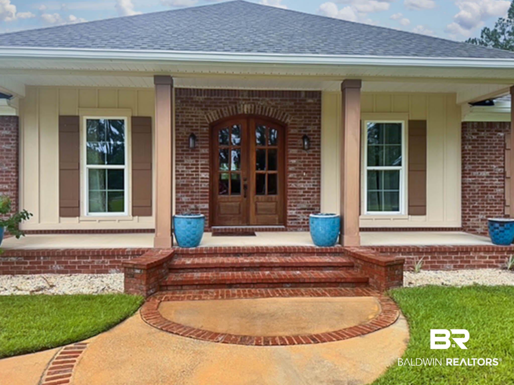 8145 Bay View Drive Foley, AL 36535 - Photo 5 of 81 Doorway to property with a porch and brick siding