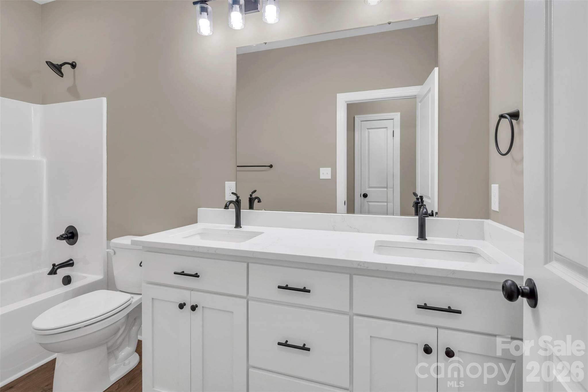 0 Cimmeron Road Lancaster, SC 29720 - Photo 23 of 29 a bathroom with a sink a toilet and a mirror