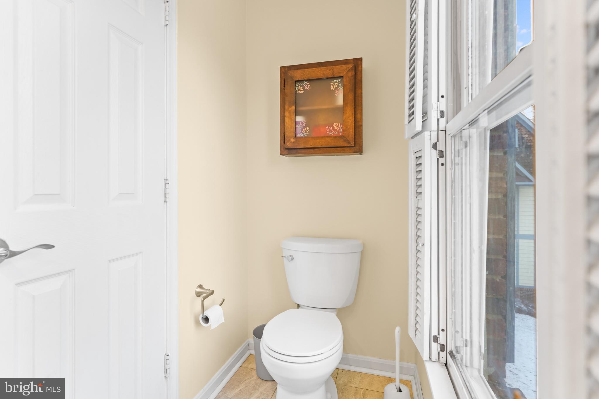 596 Chestertown Street Gaithersburg, MD 20878 - Photo 16 of 56 a white toilet sitting next to a bathroom sink