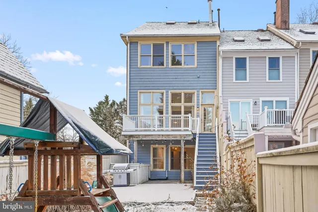 a kitchen with granite countertop stainless steel appliances a refrigerator cabinets and a sink
