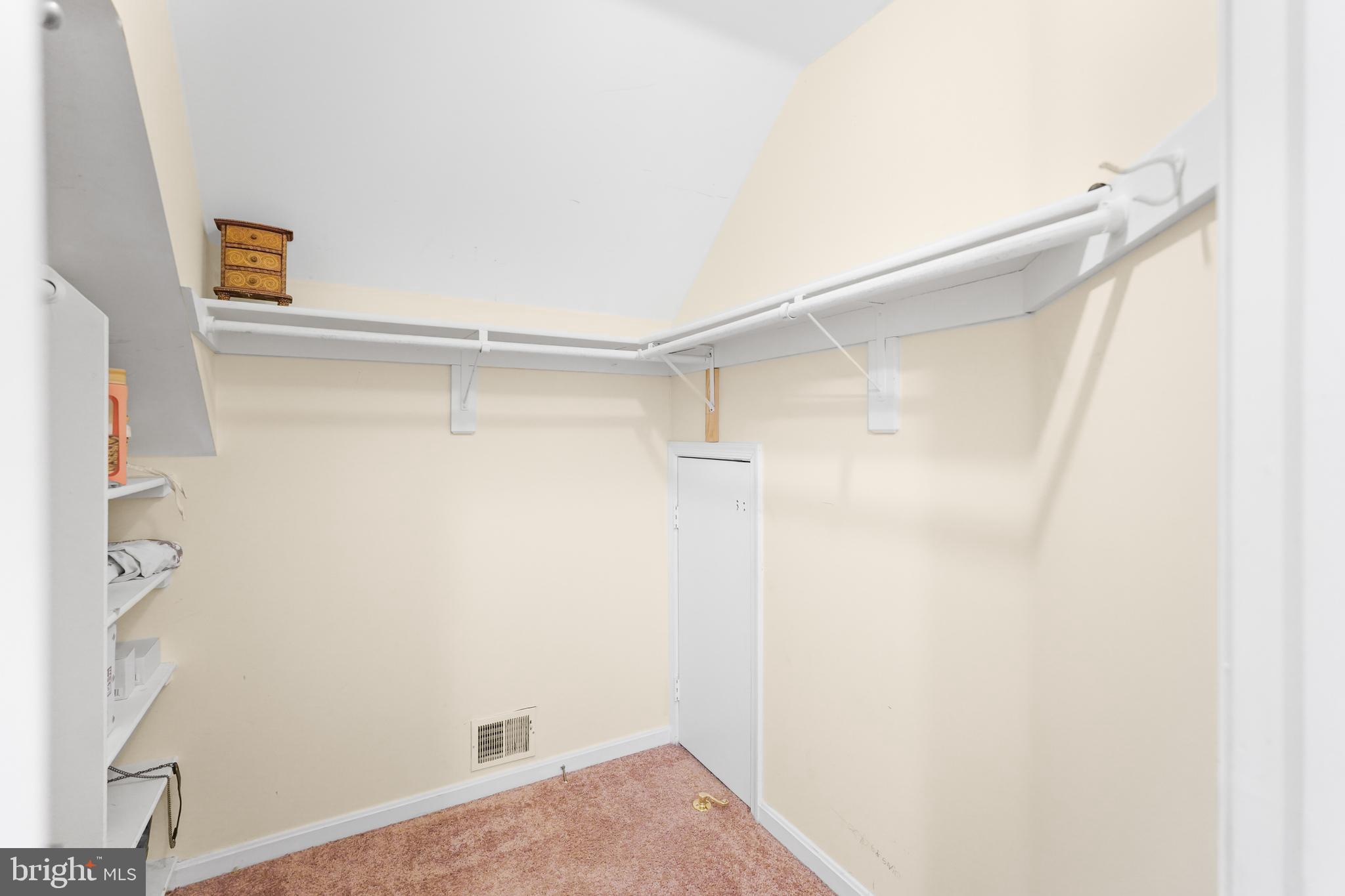 596 Chestertown Street Gaithersburg, MD 20878 - Photo 32 of 56 a view of walk in closet with empty racks