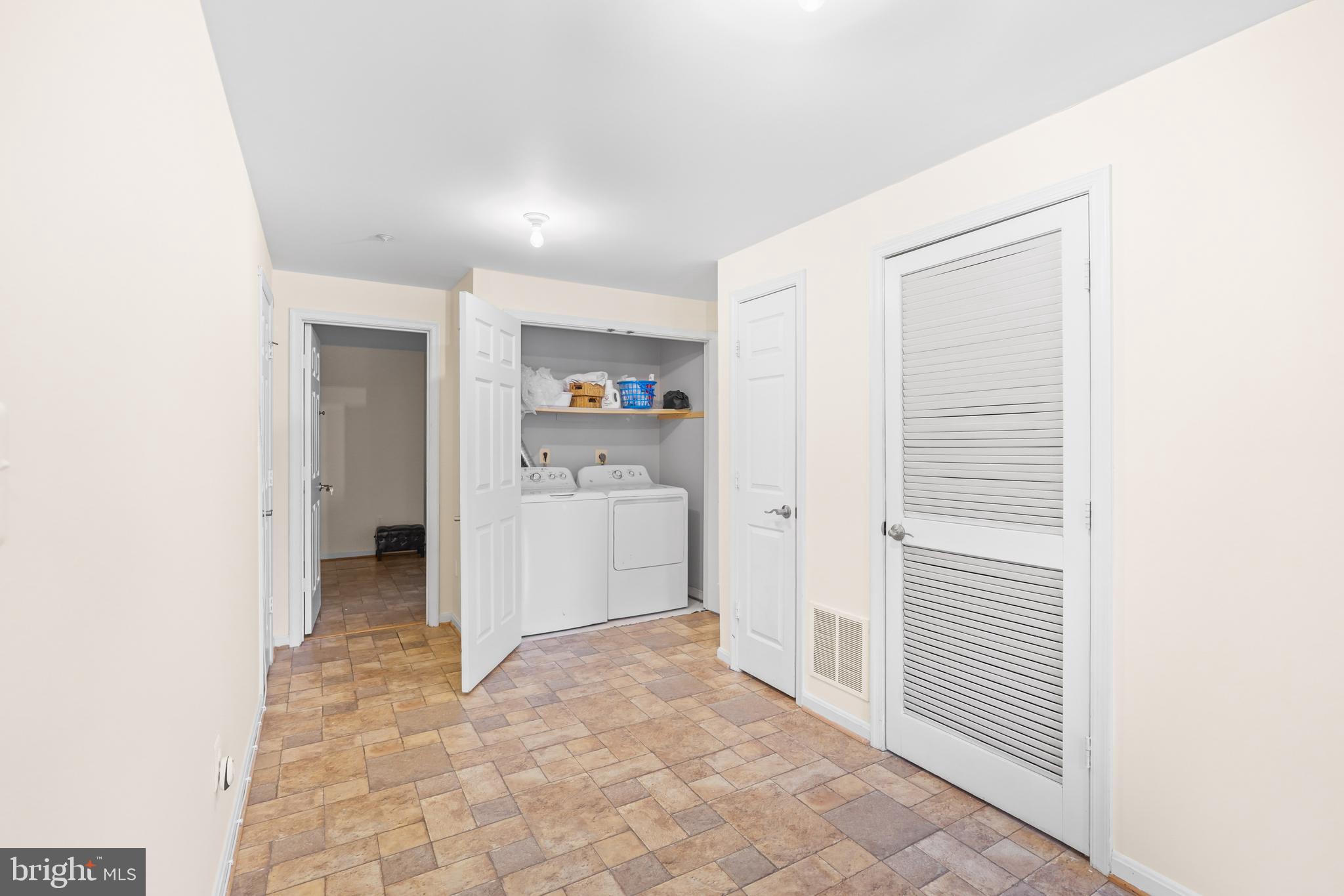 596 Chestertown Street Gaithersburg, MD 20878 - Photo 40 of 56 a view of a hallway to closet and utility room