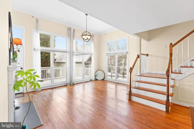 a view of entryway with wooden floor and stairs