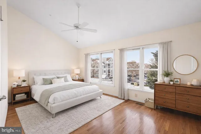 a view of a bedroom with furniture and window
