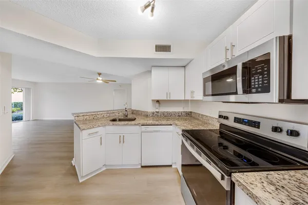 a kitchen with a stove and a microwave