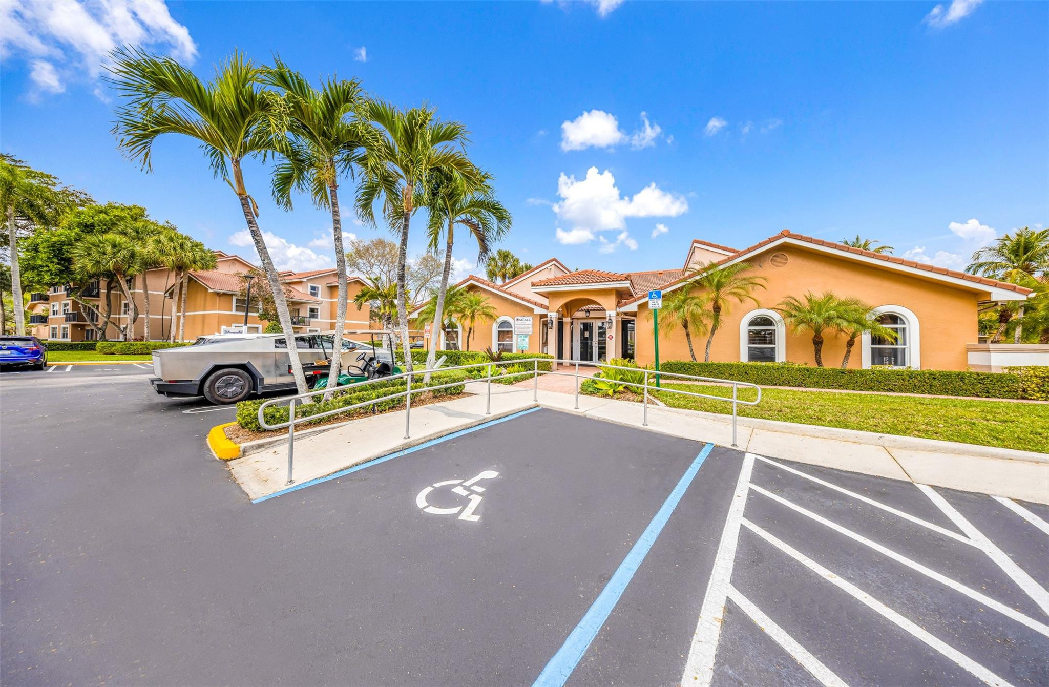 8977 Wiles Road, Unit 102 Coral Springs, FL 33067 - Photo 36 of 37 a view of swimming pool with outdoor seating and yard