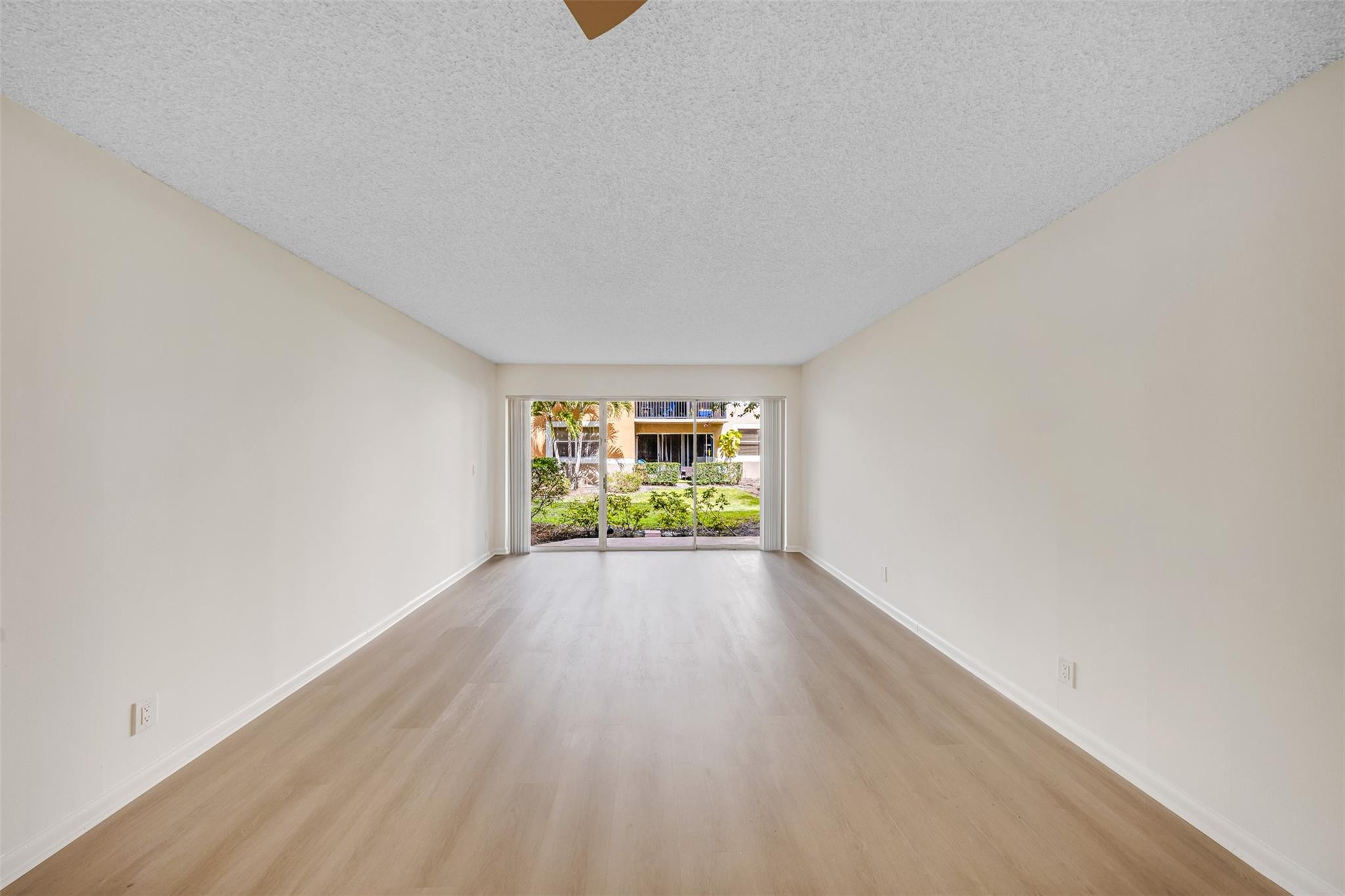 8977 Wiles Road, Unit 102 Coral Springs, FL 33067 - Photo 8 of 37 a view of an empty room and window