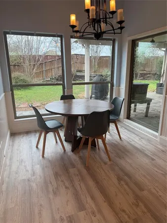a view of a dining room with furniture window and outside view