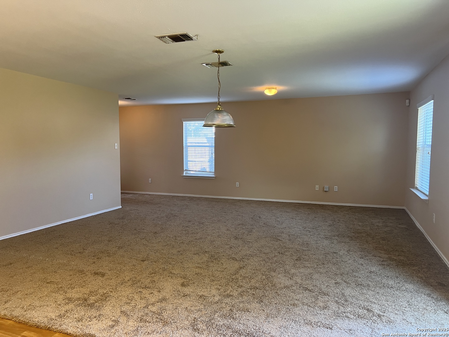 8163 Heights Valley Converse, TX 78109 - Photo 2 of 13 a view of empty room with windows