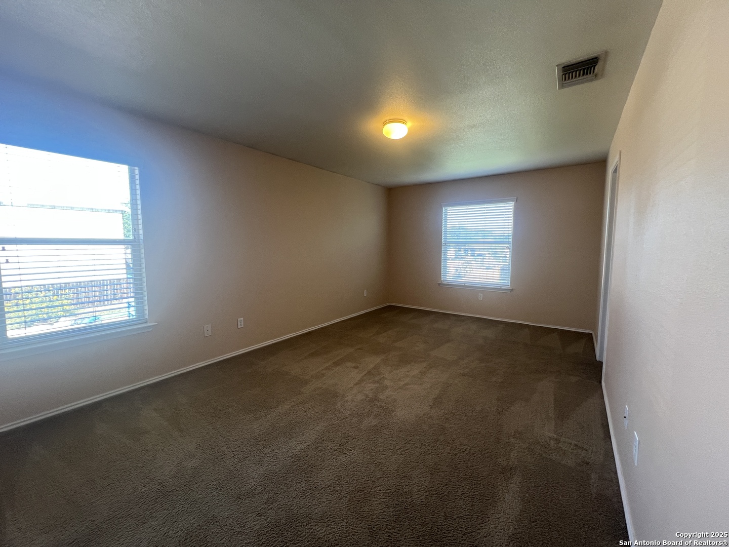 8163 Heights Valley Converse, TX 78109 - Photo 6 of 13 a view of an empty room and a window