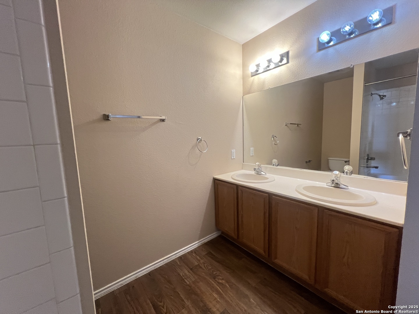 8163 Heights Valley Converse, TX 78109 - Photo 8 of 13 a bathroom with a double vanity sink and mirror