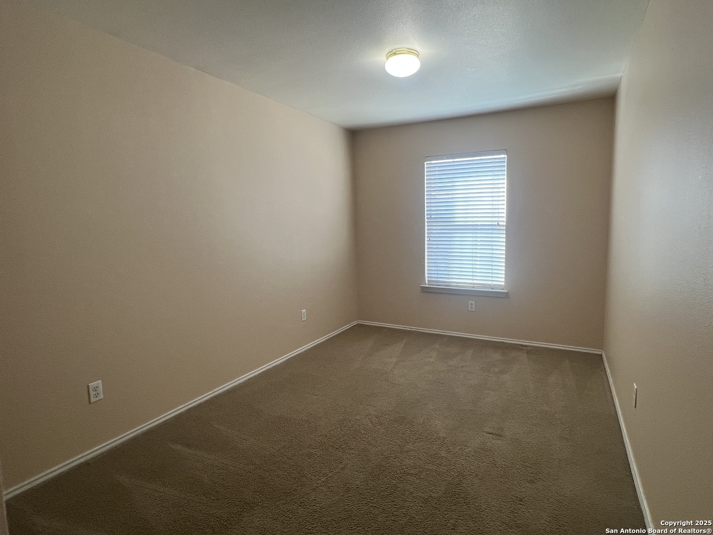 8163 Heights Valley Converse, TX 78109 - Photo 10 of 13 an empty room with a window