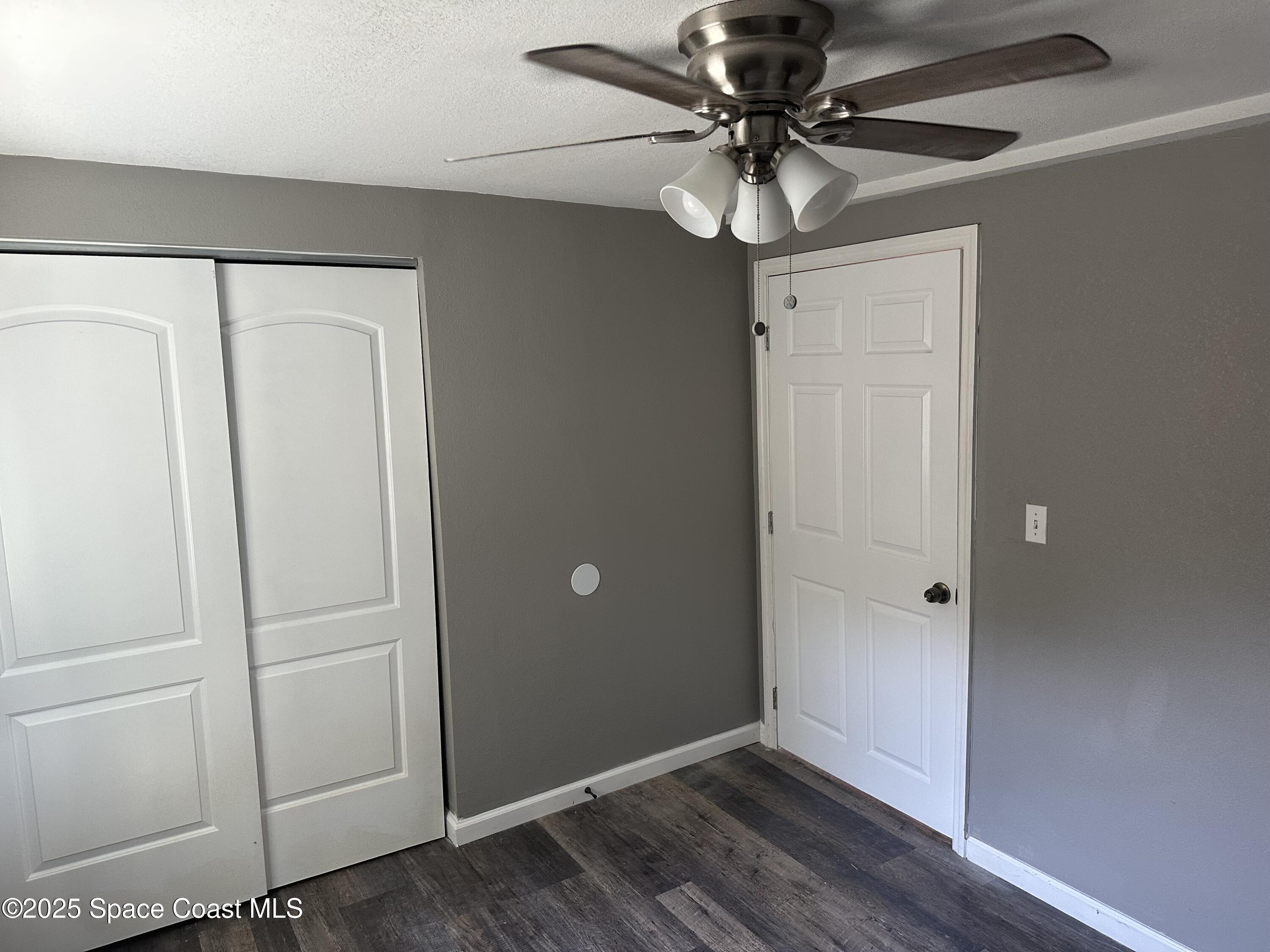 330 Palm Avenue, Unit 3 Cocoa, FL 32922 - Photo 6 of 6 a view of a livingroom with a chandelier fan