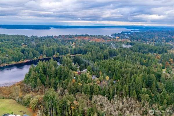 a view of a lake with top of house