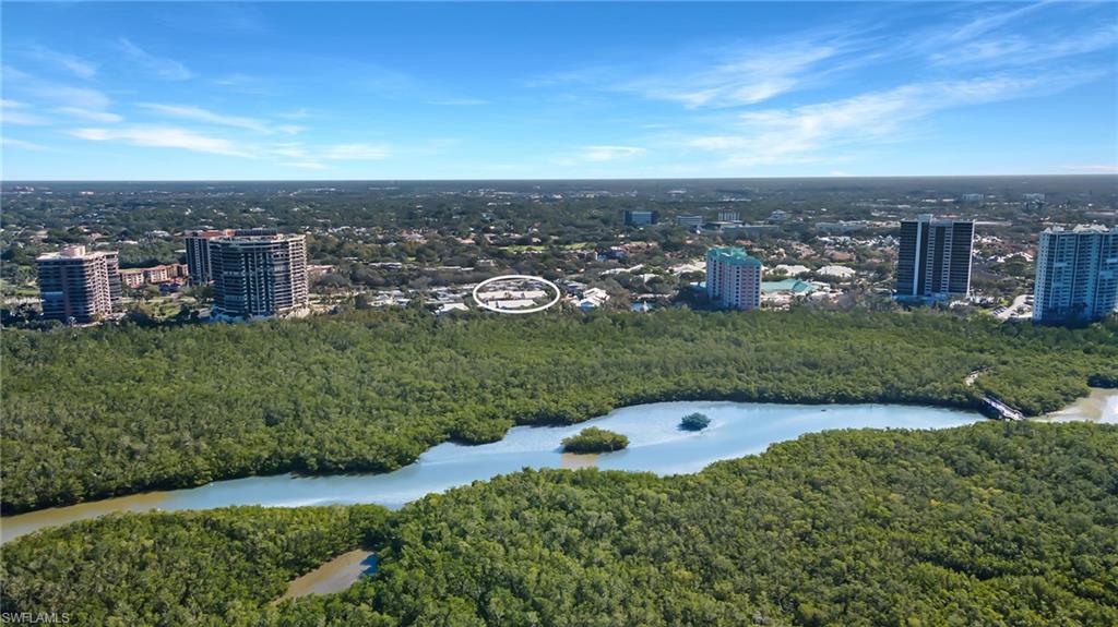5899 Chanteclair Drive, Unit 214 Naples, FL 34108 - Photo 22 of 24 an aerial view of a house with a yard