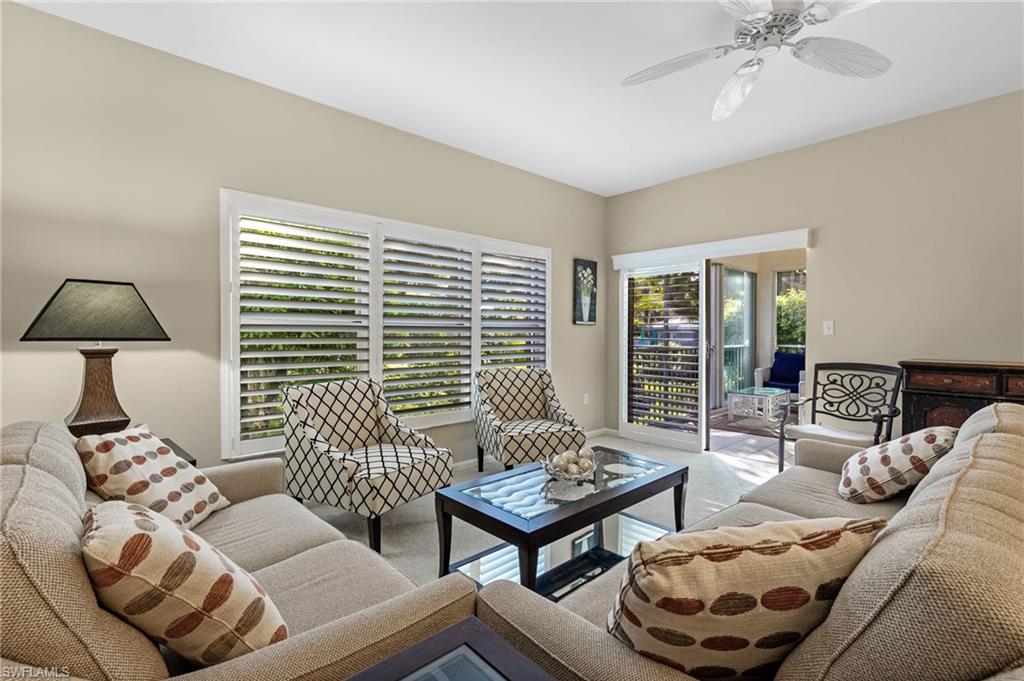5899 Chanteclair Drive, Unit 214 Naples, FL 34108 - Photo 3 of 24 a living room with furniture and a window