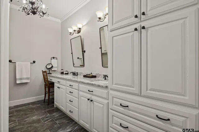 a bathroom with a double vanity sink mirror and