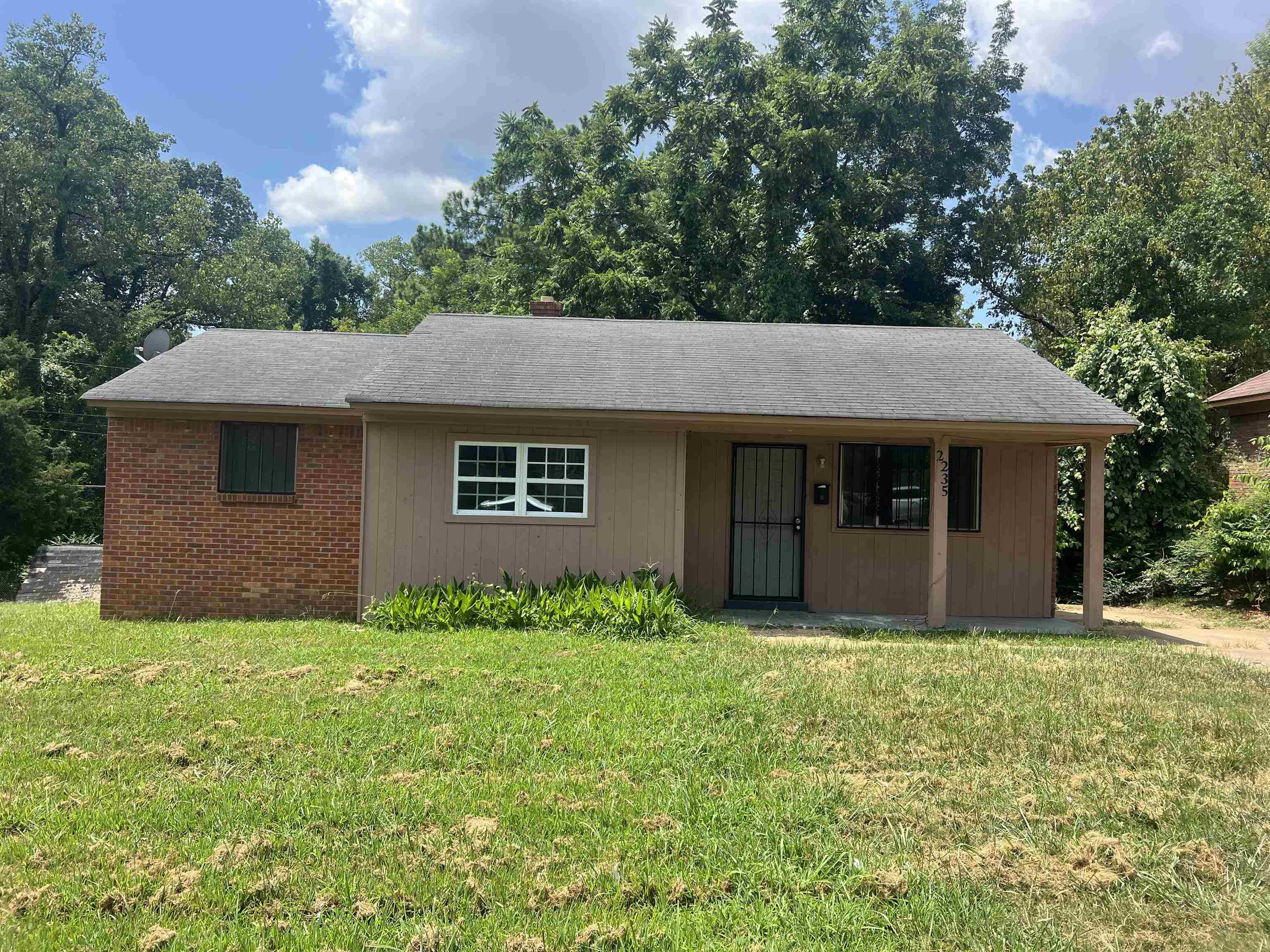 2235 Charjean Road Memphis, TN 38114 - Photo 13 of 15 Ranch-style house featuring a front yard and a shingled roof