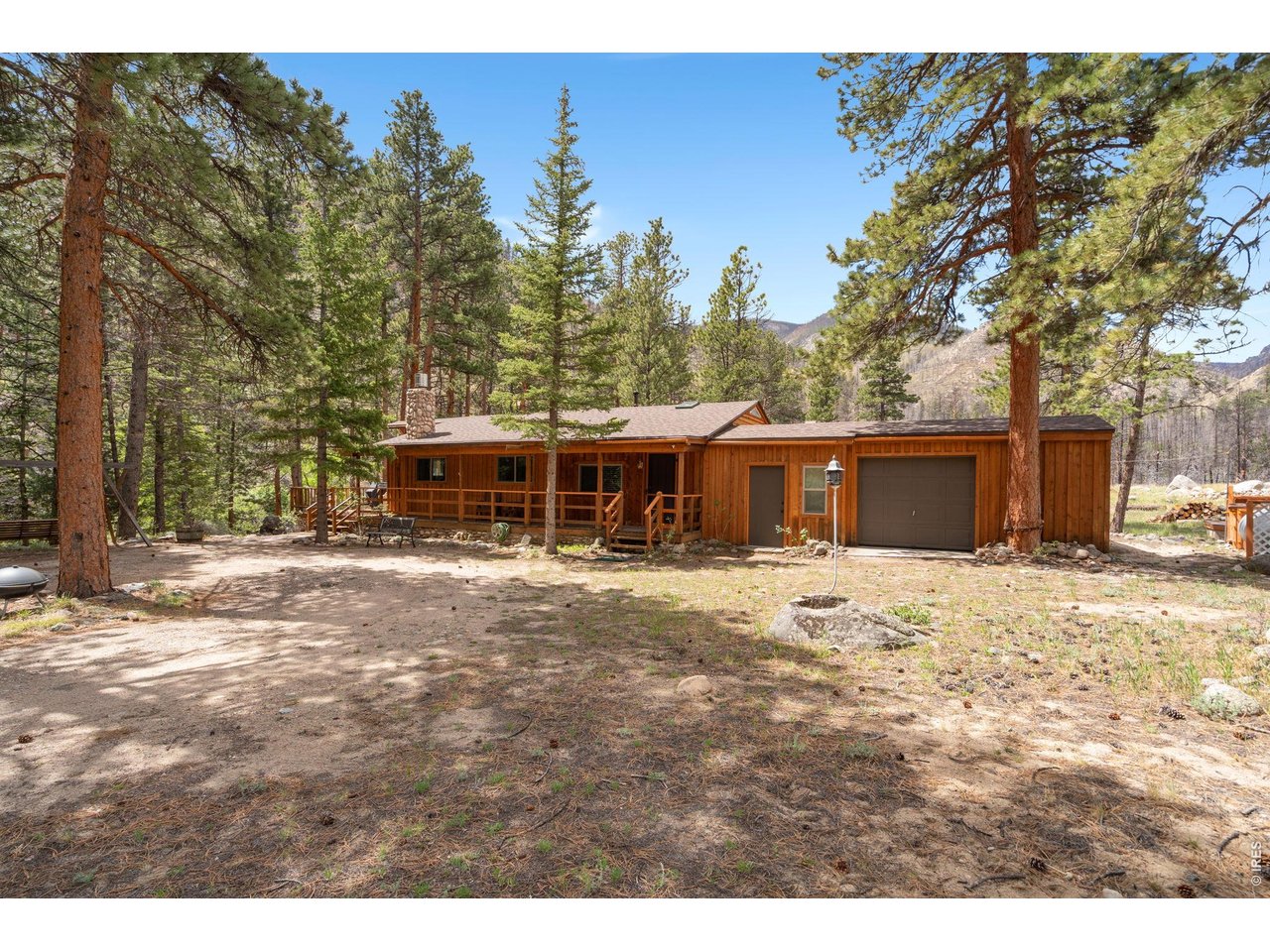 36917 Poudre Canyon Road Bellvue, CO 80512 - Photo 2 of 46 A 2 bed/2bath home nestled in the trees with a one car garage and separate store room