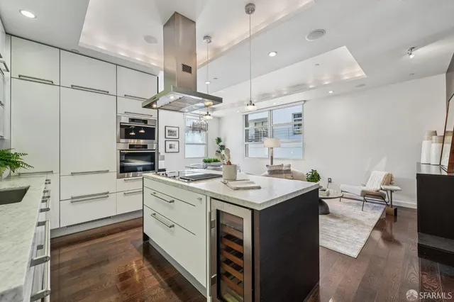 a kitchen with a sink stainless steel appliances and cabinets