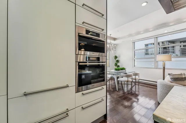 a view of living room and dining room with furniture