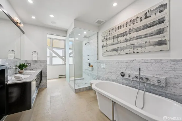 a bathroom with a bathtub and sink