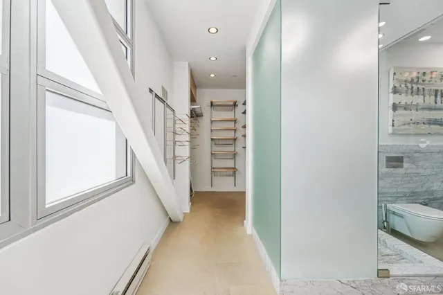 a view of a hallway with staircase