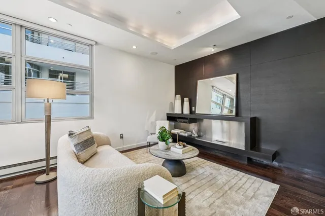 a living room with furniture and a table