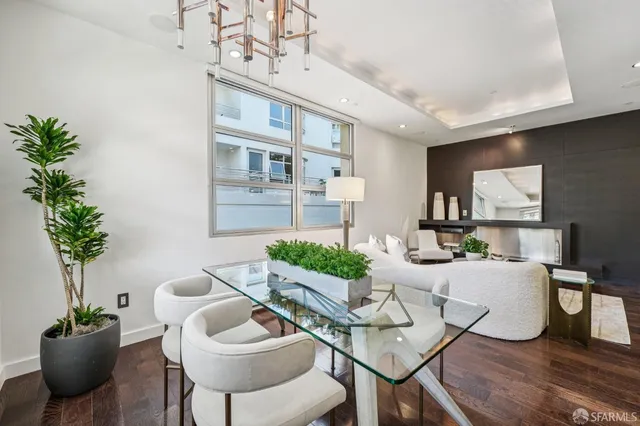 a living room with furniture potted plant and a window
