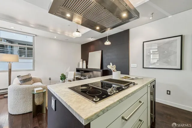 a white stove top oven sitting inside of a kitchen